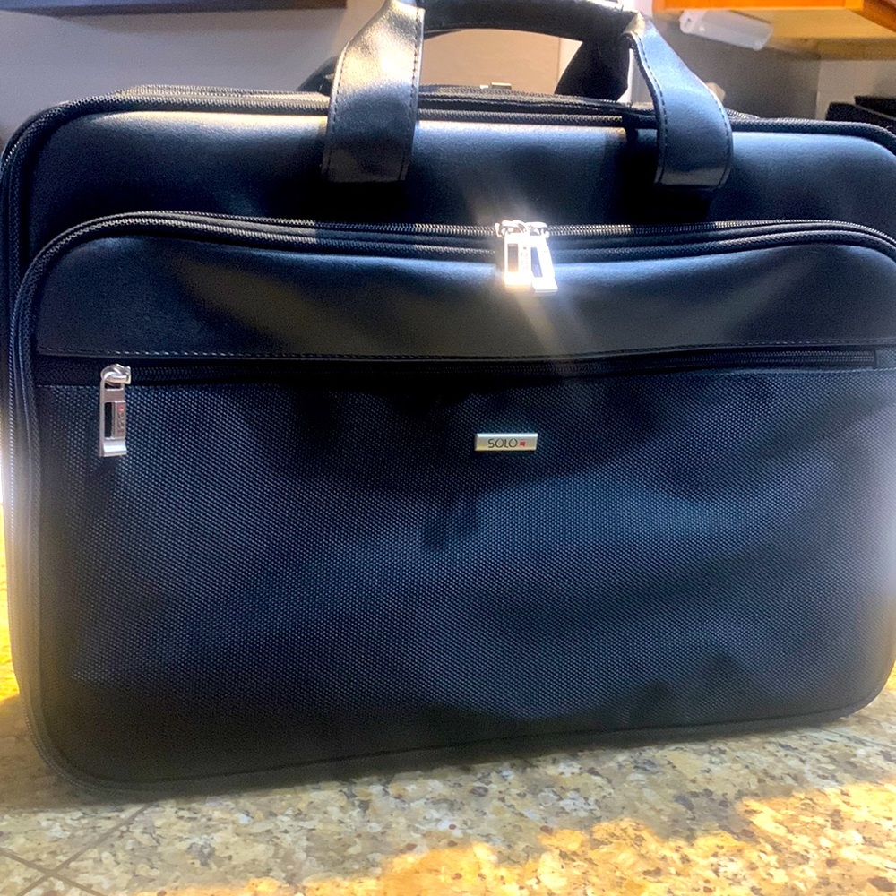 Briefcase with Laptop holder section.